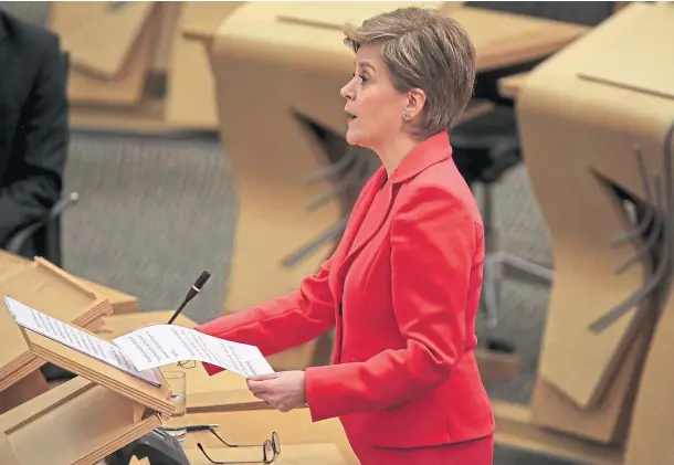  ?? ?? RESTRICTIO­NS: First Minister Nicola Sturgeon announced the phased lifting of some coronaviru­s rules during her speech at Holyrood yesterday.