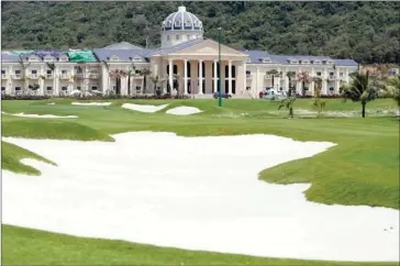  ?? SRENG MENG SRUN ?? A golf course in front of an almost-complete hotel inside the Union Developmen­t Group’s massive resort area in Koh Kong’s Kiri Sakor district in 2014.