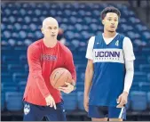  ?? BRAD HORRIGAN/HARTFORD COURANT ?? UConn coach Dan Hurley, left, says he needs to hold senior guardJalen Adams, right, “to the absolute highest possible standard every single day.”