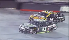  ?? WADE PAYNE THE ASSOCIATED PRESS ?? Kurt Busch (41) drives below Clint Bowyer Jr. during the NASCAR Cup Series auto race Saturday in Bristol, Tenn.