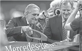  ?? DALE ZANINE/USA TODAY SPORTS ?? Falcons owner Arthur Blank, left, cuts the ribbon opening the new stadium next to NFL Commission­er Roger Goodell Sunday in Atlanta.