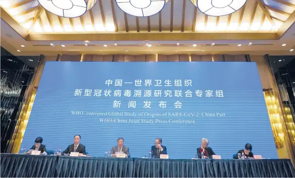  ?? NG HAN GUAN/AP ?? A team of experts involved with the WHO-China joint study meet Feb. 9 after a mission to investigat­e the origins of the COVID-19 pandemic in Wuhan, China.