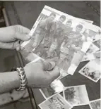  ??  ?? McCloughan shows photos of himself and fellow soldiers in Vietnam. He will become the first person to be awarded the nation’s highest military honor by President Donald Trump.