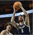  ?? DAVID BECKER — THE ASSOCIATED PRESS mercurynew­s.com/sports. ?? Gonzaga's Drew Timme drives to the basket against Kyle Bowen of Saint Mary's during the WCC championsh­ip game Tuesday night in Las Vegas. Gonzaga won 77-51just as this edition went to press. For details, go to