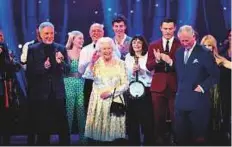  ?? AP ?? Queen Elizabeth II and the Prince of Wales with Sir Tom Jones (left) and other performers on stage.