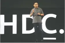  ?? FRED
DUFOUR/AFP/GETTY IMAGES ?? Richard Yu, head of Huawei’s consumer business group, unveils the new HarmonyOS operating system in Dongguan, China on Friday.