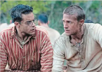  ?? JOSE HARO THE ASSOCIATED PRESS ?? Rami Malek, left, and Charlie Hunnam in a scene from "Papillon," which is primarily a buddy picture, but with lots and lots of suffering.