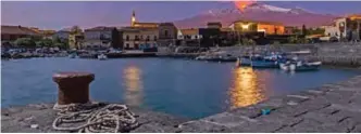  ??  ?? In this photo, snow-covered Mount Etna, Europe's most active volcano, spews lava during an eruption seen from the Sicilian village of Pozzillo, Italy.