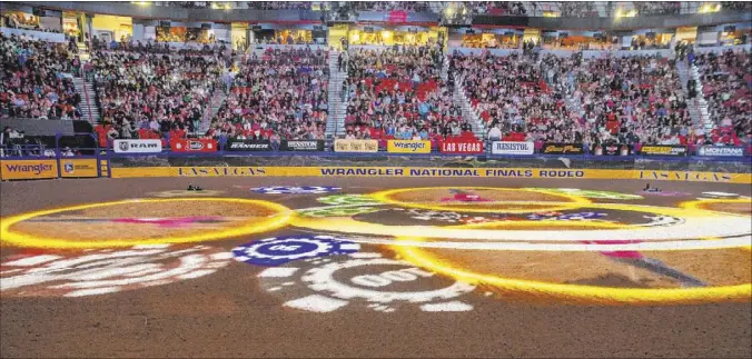  ?? L.E. Baskow Las Vegas Review-Journal @Left_Eye_Images ?? Las Vegas goes all out at the Thomas & Mack Center for the National Finals Rodeo, an event that brings millions into the local economy during a slow time.