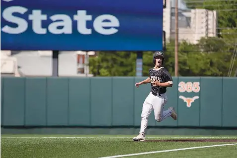  ?? Staff photo by Evan Lewis ?? Pleasant Grove sophomore catcher Keaton Russo looks back at the dugout in shock after hitting it out of the park in the fifth inning Wednesday in the Hawks' Class 4A semifinal against Abilene Wylie on Wednesday at UFCU Disch-Falk Field in Austin. It...