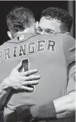  ?? Paul Sancya / Associated Press ?? Bregman gets a hearty hug fromAstros teammate George Springer.