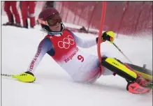  ?? ROBERT F. BUKATY — THE ASSOCIATED PRESS ?? Mikaela Shiffrin crashes during the combined slalom at the Winter Olympics on Thursday. It was one of three events she did not finish in Beijing.