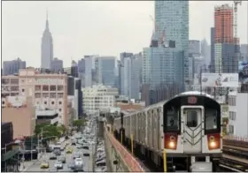  ?? FRANK FRANKLIN II — THE ASSOCIATED PRESS FILE ?? In this file photo, patrons ride the number 7 subway train in the Queens borough of New York. If you’re a transporta­tion buff, New York City is the perfect destinatio­n.