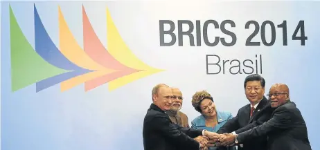  ?? Picture: REUTERS ?? LENDING A HAND: Russian president Vladimir Putin, Indian prime minister Narendra Modi, Brazilian president Dilma Rousseff, Chinese president Xi Jinping and President Jacob Zuma pose for a group photo session during the sixth Brics summit in Fortaleza,...