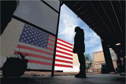  ?? Photograph­s by Allen J. Schaben Los Angeles Times ?? KENNETH SALAZAR takes in Potter’s Lane, a complex of recycled shipping containers for the homeless, especially veterans.