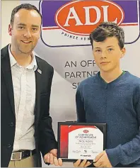  ?? SUBMITTED ?? ADL marketing manager Jamie MacPhail presented Nick Harris with the top shot Bear award during the Biathlon P.E.I. awards night.