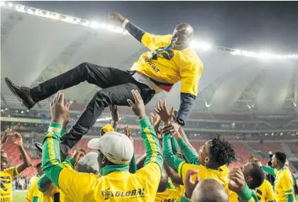  ?? Picture: Gallo Images ?? HIGHEST TODAY. Baroka players celebratin­g their win by throwing coach Wedson Nyirenda into the air after winning the Telkom Knockout against Pirates at the Nelson Mandela Bay Stadium.