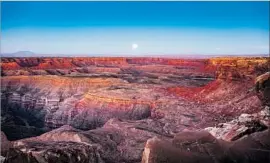  ?? Jim Lo Scalzo EPA/Shuttersto­ck ?? THE MOON above Bears Ears National Monument. Trump’s declaratio­n sets the stage for a court battle over presidenti­al authority to alter a national monument.