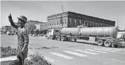  ?? [THE OKLAHOMAN ARCHIVES] ?? A tanker truck drives on Highway 81 in Kingfisher, where oil and natural gas drilling is extremely active. But the area is so developed that private equity investors have moved on to less expensive Oklahoma energy plays.