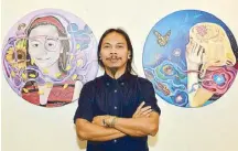 ??  ?? Leyte artist Dante Enage beside his artworks “Malaya” and “Let the Memories Flow.” Dante is well known for using the red lauan tan bark tree, the natural pigmenting agent of local wine, tuba.