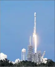  ?? John Raoux Associated Press ?? A SPACEX Falcon 9 rocket carrying a communicat­ions satellite lifts off from Kennedy Space Center.