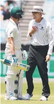  ?? Picture: MICHAEL KLEIN ?? Australia's Steve Smith talks with umpire Nigel Llong as they head off to the lunch break.
