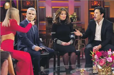  ?? Nicole Weingart Bravo ?? ARIANA MADIX, left, and Tom Sandoval, right, argue on either side of Andy Cohen and Lisa Vanderpump during Part 1 of the reunion.