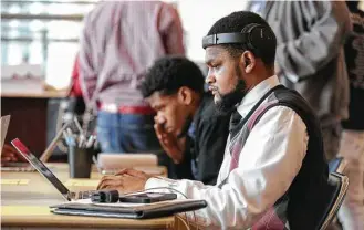  ?? Yi-Chin Lee / Houston Chronicle ?? Jamaal Walker fills out an electronic applicatio­n Saturday at RodeoHoust­on’s job fair at NRG Stadium. While the rodeo boasts more than 30,000 volunteers, plenty of paid jobs are available.