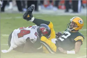  ?? THE ASSOCIATED PRESS ?? Green Bay Packers quarterbac­k Aaron Rodgers (12) gets sacked by Tampa Bay Buccaneers inside linebacker Lavonte David (54) during the first half of an NFL football game Sunday, Oct. 18, 2020, in Tampa, Fla.