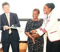  ??  ?? Canadian ambassador to Zimbabwe Rene Cremonese (left), AWFMT executive director Dr Chido Matewa and Friendship High School head girl Wendy Kundishora at the launch of the guide and documentar­y