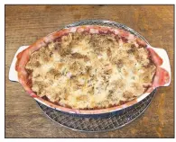  ?? (Courtesy photo) ?? Dillard’s favorite cobbler, whether made from peaches or berries, is topped with a crusty coconut-pecan combinatio­n.