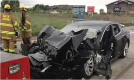  ?? Photograph: AP ?? A Tesla Model S, which was involved in a traffic collision with a fire truck in Utah.