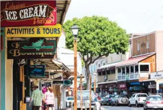  ??  ?? Photo provided by the Hawaii Tourism Authority shows a view of Front Street in Lahaina, Maui, Hawaii.