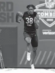  ?? Darron Cummings / Associated Press ?? Tariq Woolen impressed NFL scouts with his 6-foot-4 frame and 4.26 speed in the 40-yard dash.