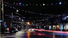  ?? Associated Press ?? ■ Car tai lights streak under Christmas lights recently turned back on March 19 in Farmington, N.H. As the coronaviru­s spreads, holiday lights are going back up to provide a bit of emotional and actual brightness.