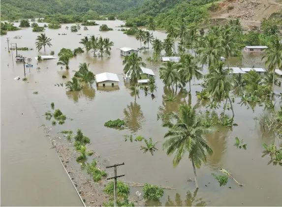  ?? Photo: Leon Lord ?? Wailotua 1 Village in Tailevu under water on 10 January’s 2022. This after the Wainibuka River burst its bank at the height of Tropical Cyclone Cody.