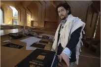  ?? (AP Photo/Robert Bumsted) ?? Rabbi Joshua Franklin stands inside the sanctuary at the Jewish Center of the Hamptons on Feb. 10 in East Hampton, New York. Franklin expermente­d writing a sermon for his congregati­on using artificial intelligen­ce software Chat GPT, and concluded that AI can’t replace the work of human faith leaders.