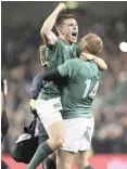  ?? | AP ?? Ireland’s Luke McGrath, left, celebrates with Keith Earls after beating the All Blacks 16-9 on Saturday.