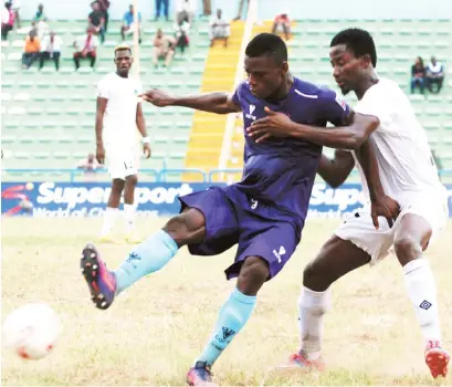  ??  ?? Stephen Odey of MFM (L) is challenged by Chima Akas of Enyimba during their Nigeria Profession­al Football League week 13 match last Saturday in Calabar. Odey scored the first goal of the match that ended 1-1