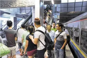  ??  ?? Commuters at the station in Woodlands Checkpoint where a new shuttle train between Woodlands and Johor Baru Sentral was launched on July 1, 2015. The Tebrau Shuttle is operated by Malaysian rail operator Keretapi Tanah Melayu.