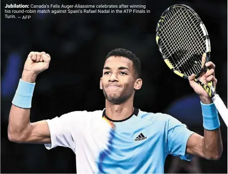  ?? — AFP ?? Jubilation: Canada’s Felix auger-aliassime celebrates after winning his round-robin match against spain’s rafael Nadal in the ATP Finals in Turin.