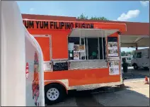  ?? (Arkansas Democrat-Gazette/Eric E. Harrison) ?? The Yum Yum Filipino Fusion food truck recently parked at the Food Truck Stop at Eighth and Chester streets in Little Rock.