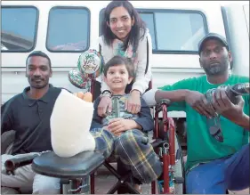  ??  ?? Nishala Hird and her son Euan, with Devan Govender (left) and Lenny Govender of Acorn Shopfitter­s who helped rescue him.