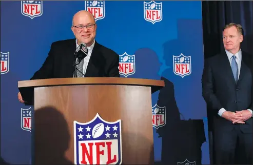  ?? JOHN BAZEMORE/AP ?? David Tepper (left) speaks as NFL commission­er Roger Goodall looks on during a news conference where he was introduced as the new owner of the Carolina Panthers at the NFL owners’ spring meeting in Atlanta yesterday.