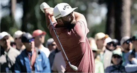  ?? |
JOHN G MABANGLO EPA ?? SPAIN’S Jon Rahm, who won his first Masters, gives his all at the tee of the fourth hole of the final round at the Augusta National Golf Club, Georgia.