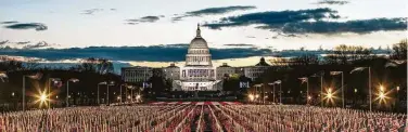  ?? Jason Andrew / New York Times ?? Top photo: Flags representi­ng people unable to attend the inaugurati­on line the National Mall on Wednesday morning in Washington.