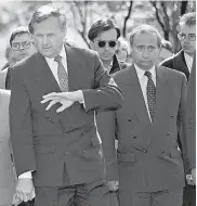  ?? DMITRI LOVETSKY/ AP ?? Anatoly Sobchak, then the mayor of St. Petersburg, left, stands with Putin in 1994.