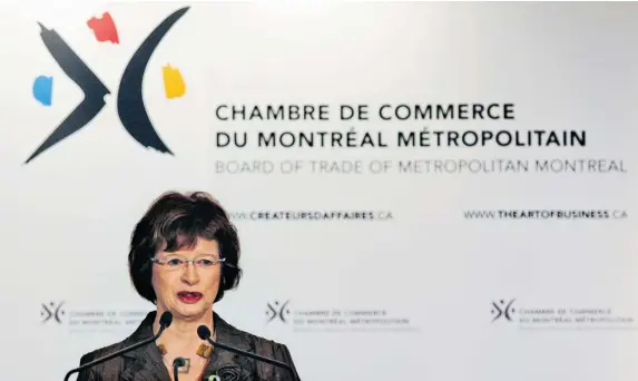  ?? JOHN MAHONEY/ THE GAZETTE ?? Education Minister Marie Malavoy speaks at the Chambre de Commerce on Friday, announcing a new kindergart­en program but giving no hint of where the money would come from.