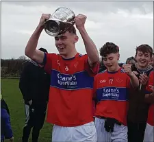  ??  ?? ISK captain Rory O’Connor collects the cup in Kileedy last week