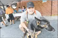  ?? Alex von Kleydorff / Hearst Connecticu­t Media ?? Veteran John Kelly gives a hug to his service dog Ranger during the Best Friends Pet Hotels fundraiser for Guardian Angels Medical Service Dog in August in Westport.